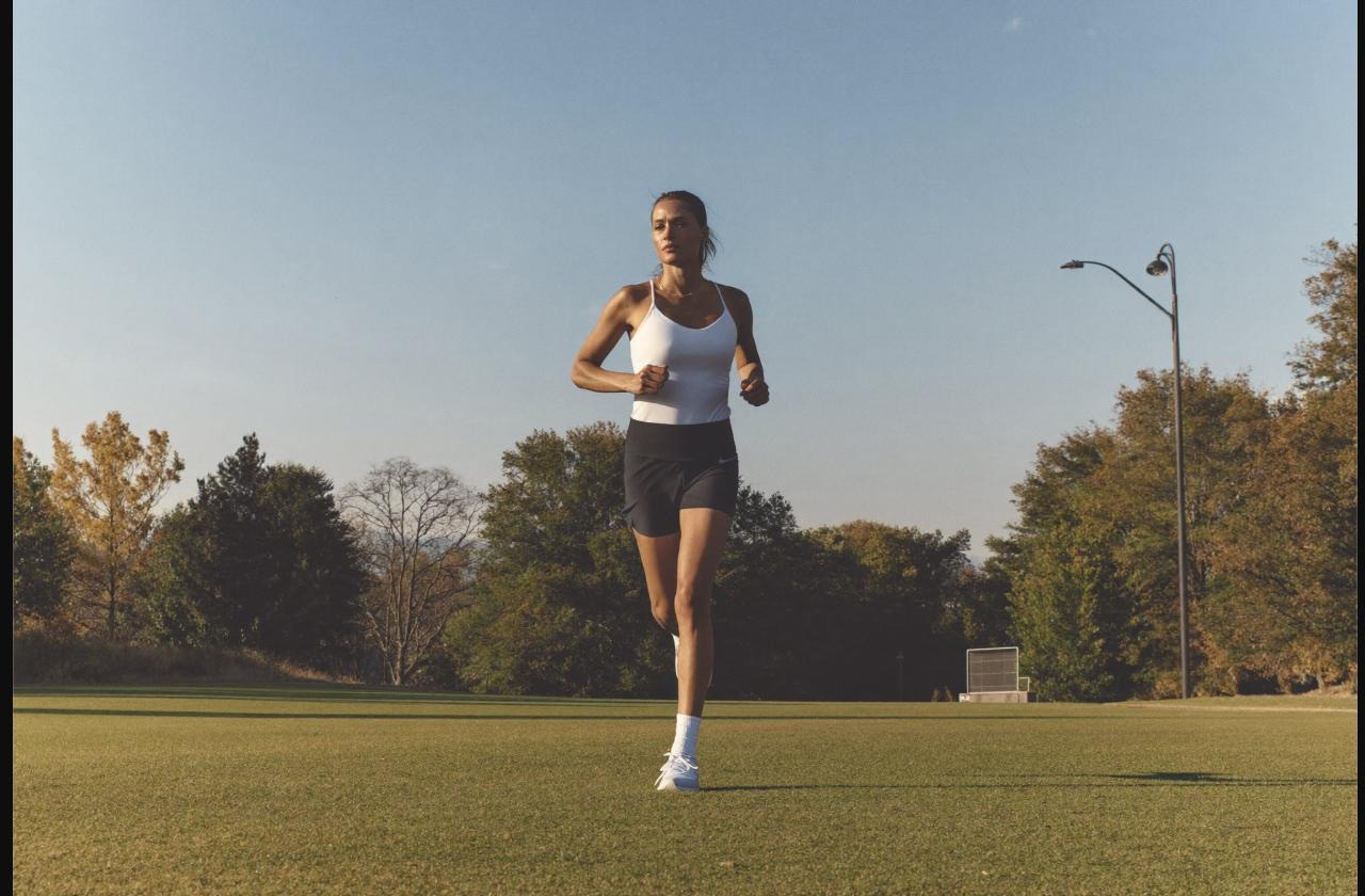 Woman running outdoors at sunrise during an endurance training session