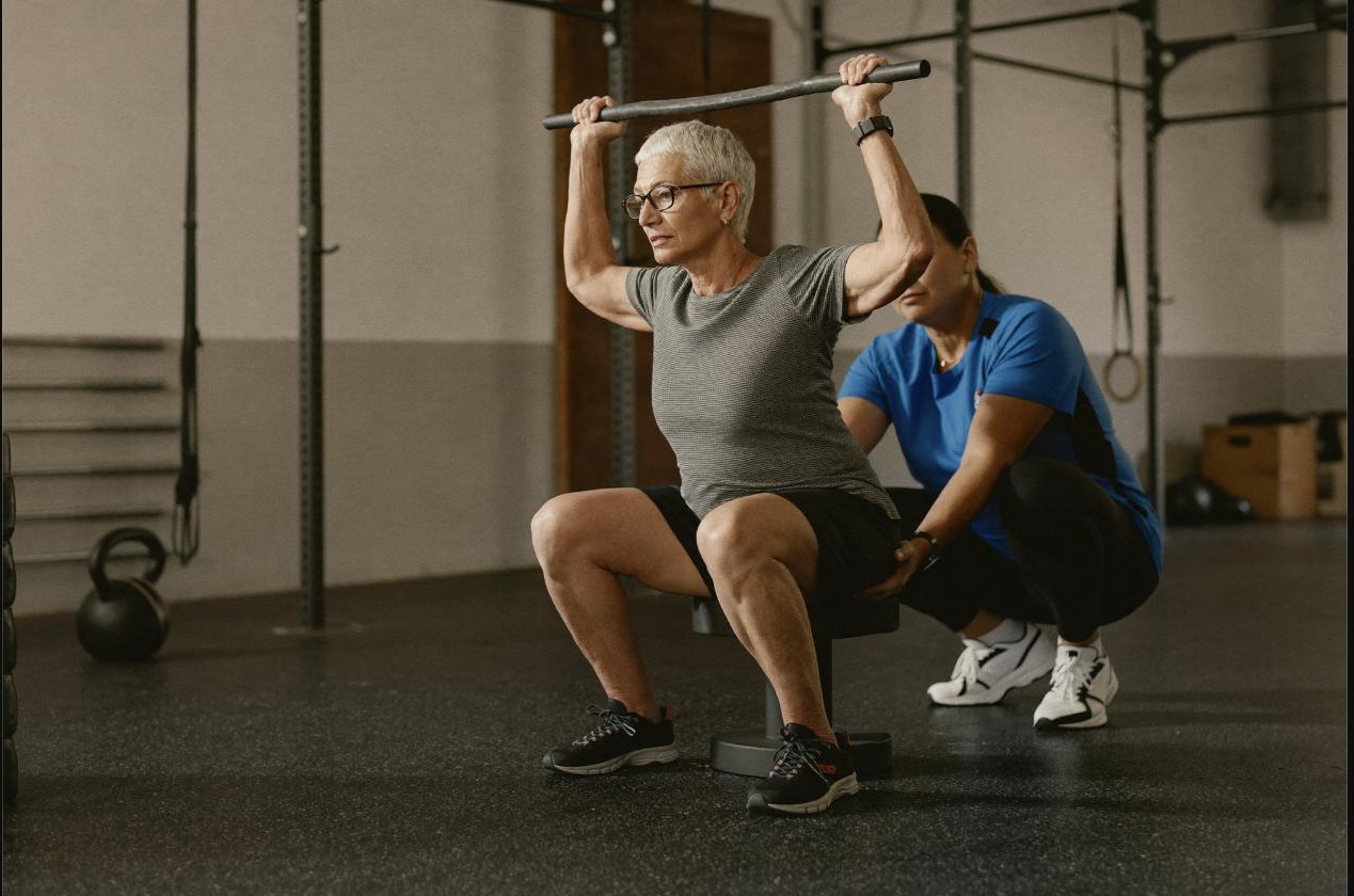 Older adult lifting weights to counter age-related muscle loss