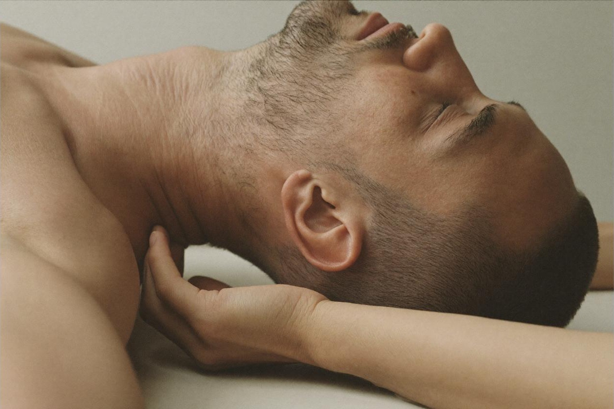 Man practicing diaphragmatic breathing, representing regulating stress before it becomes overload