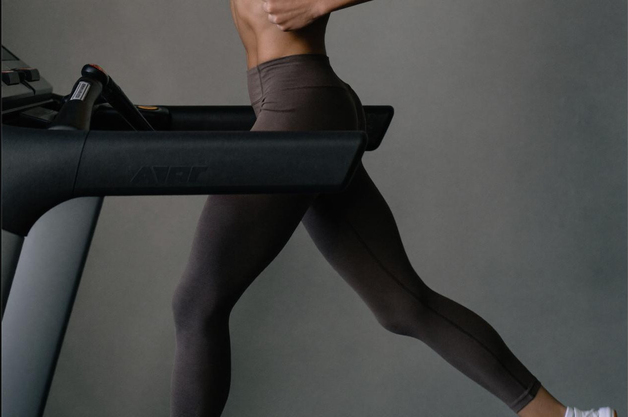 Athlete running on a treadmill wearing VO2 max testing equipment