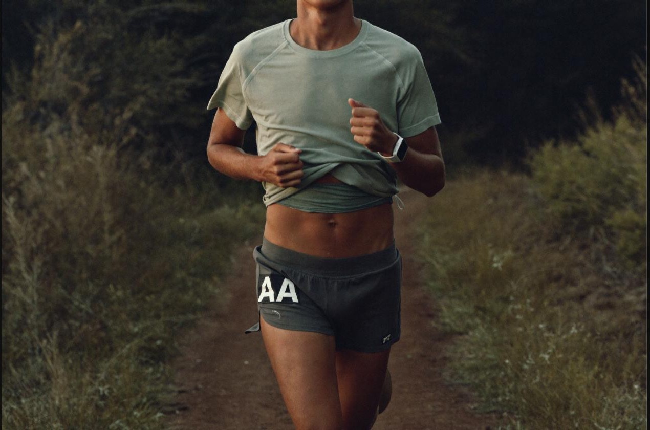 Relaxed runner with a heart-rate graphic representing Zone 2 training
